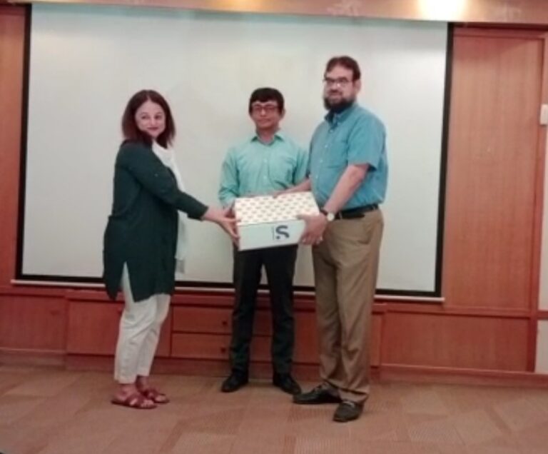 Dr Abdul Bari Khan presenting memento to Sanofi